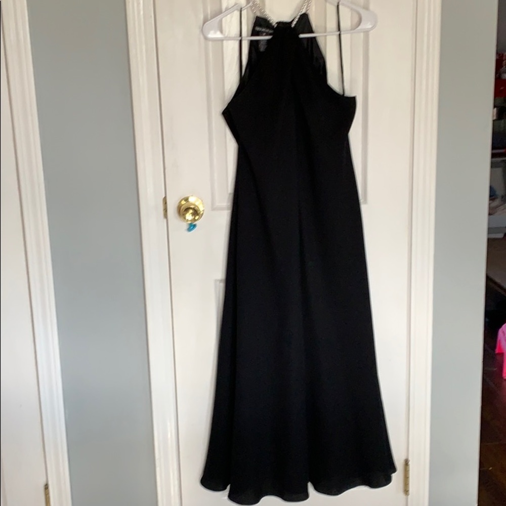 Black sleeveless dress with pearl neck
